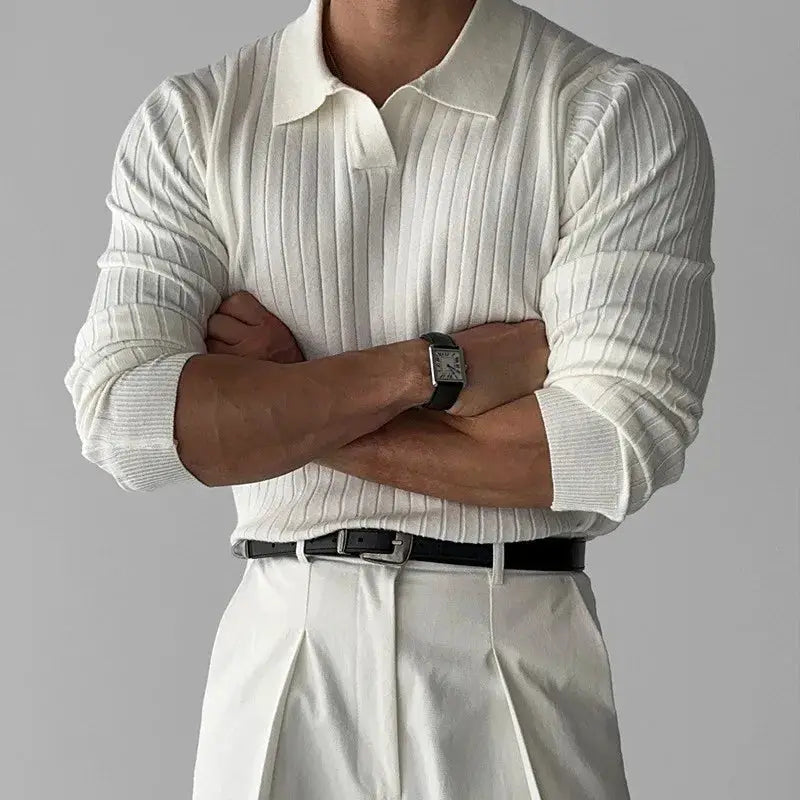 Men's white ribbed knit polo shirt with collar, long sleeves, styled with light trousers
