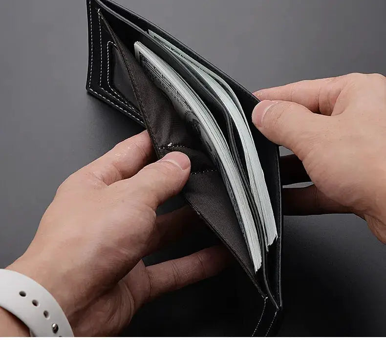 PU leather short men's wallet by Simples Market, thin folding card holder in black with white stitching