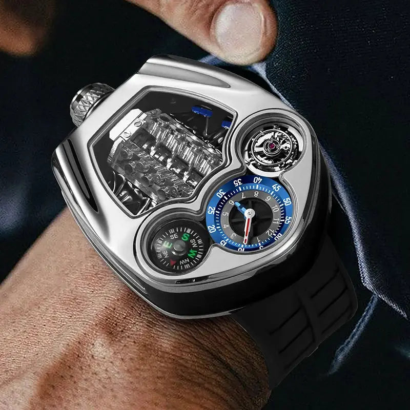 PINDU Design men's watch with silver case, blue ring dial, compass, and black silicone strap.