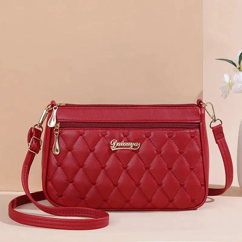 NovaLuxe PU Leather Messenger Bag For Women With Fur Ball Accent And Secure Zipper Closure