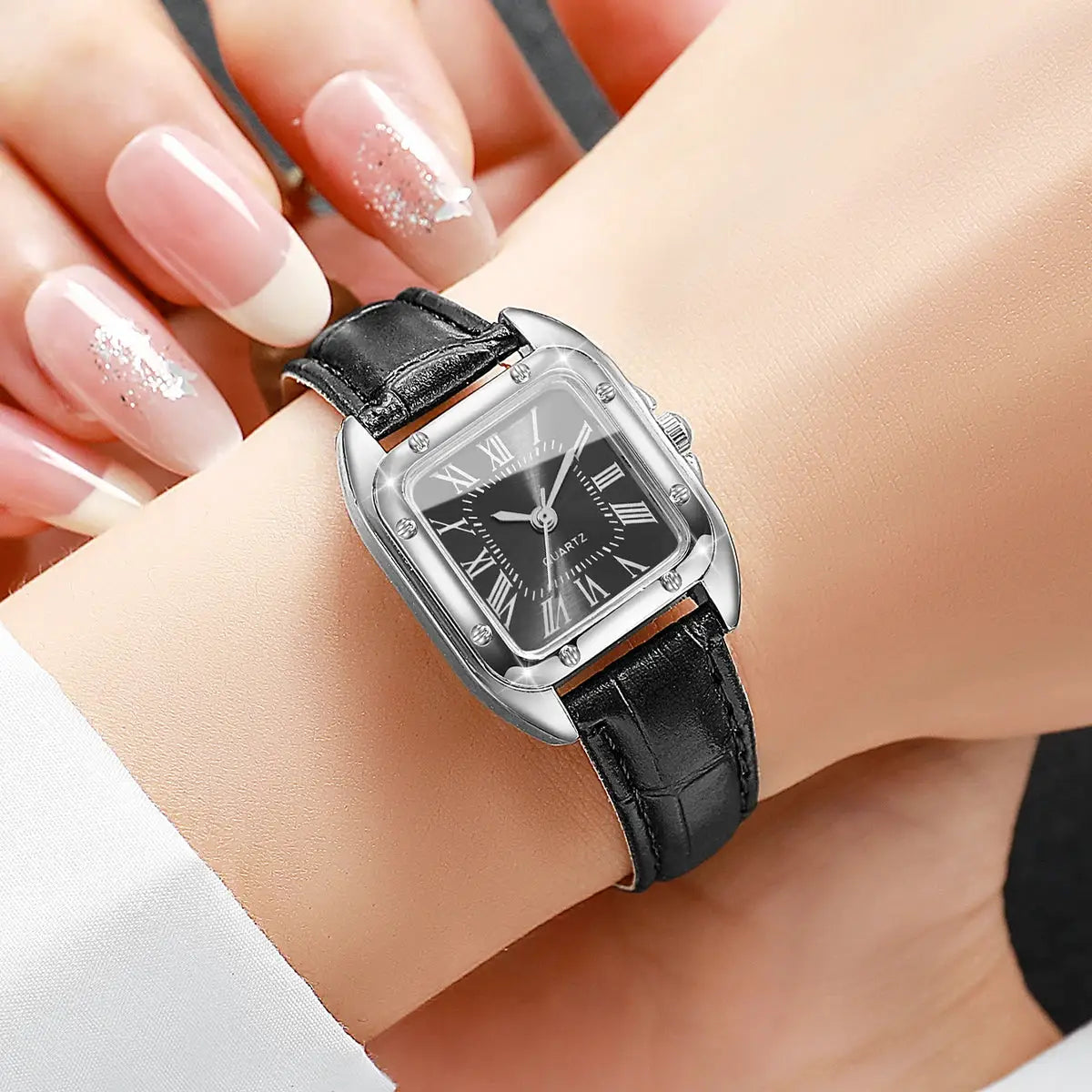 Simples Market square women's leather strap wristwatch with black Roman numeral dial and silver case.