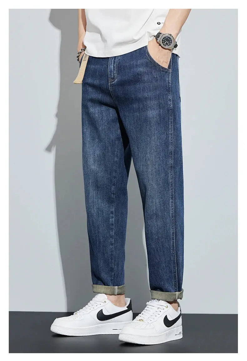 Men's dark blue denim jeans by Simples Market, loose straight fit with rolled cuffs