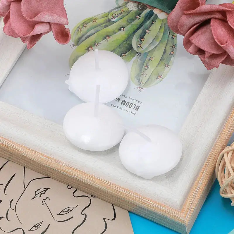 Floating unscented white disc candles, 3-piece set