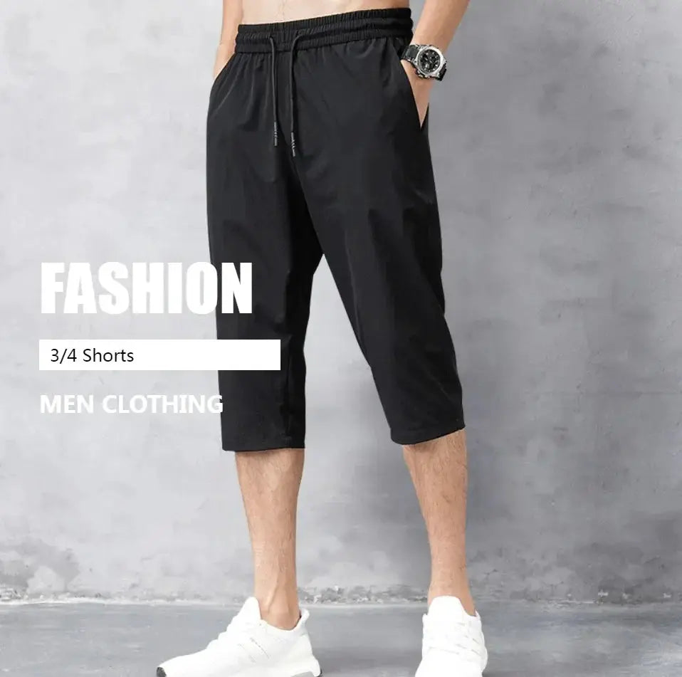 Men's black 3/4 length shorts with elastic waist and drawstring, quick-dry nylon stretch Bermuda style