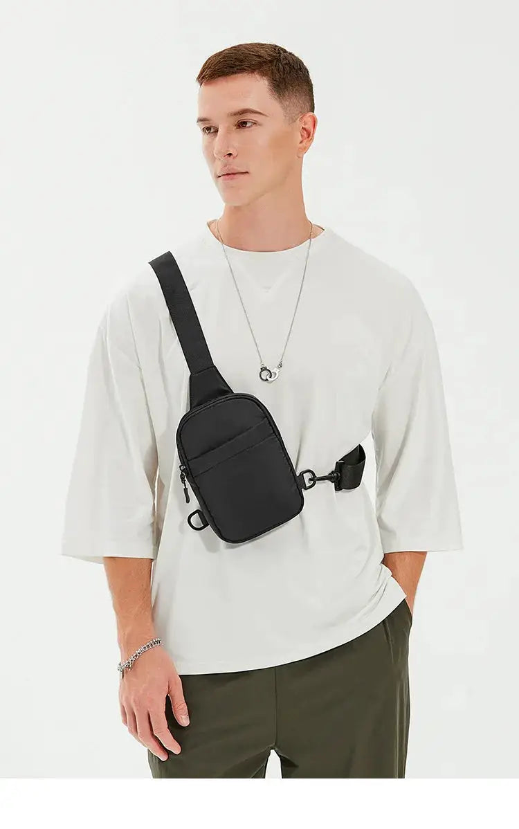 2In1 multi-functional waist bag, black compact crossbody sling bag worn across the chest on a model