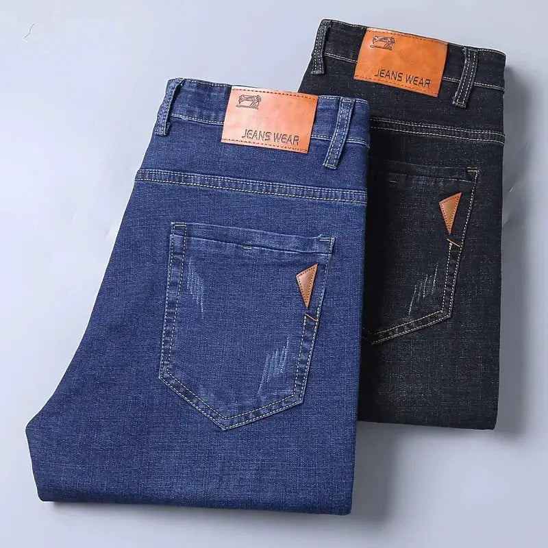 Men's jeans set: two denim pants in light blue and dark indigo with back pockets and leather patches