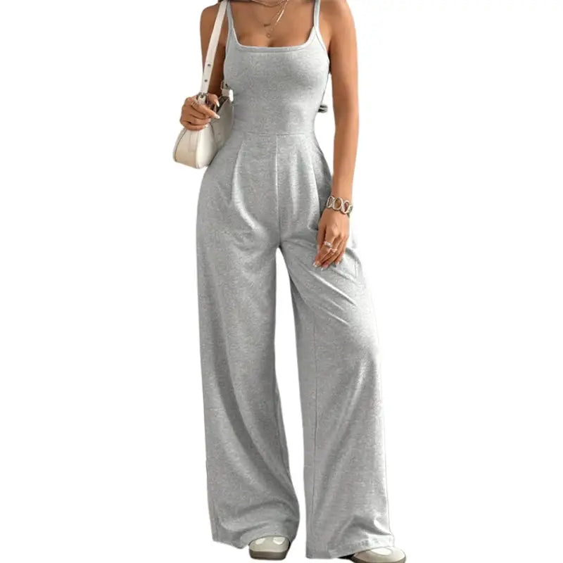 Women's grey halter-neck backless sleeveless jumpsuit with wide-leg, floor-length trousers