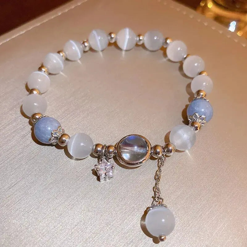 Blue purple opal stone bracelet for women with moon-star crystal pendant and white-blue beads.