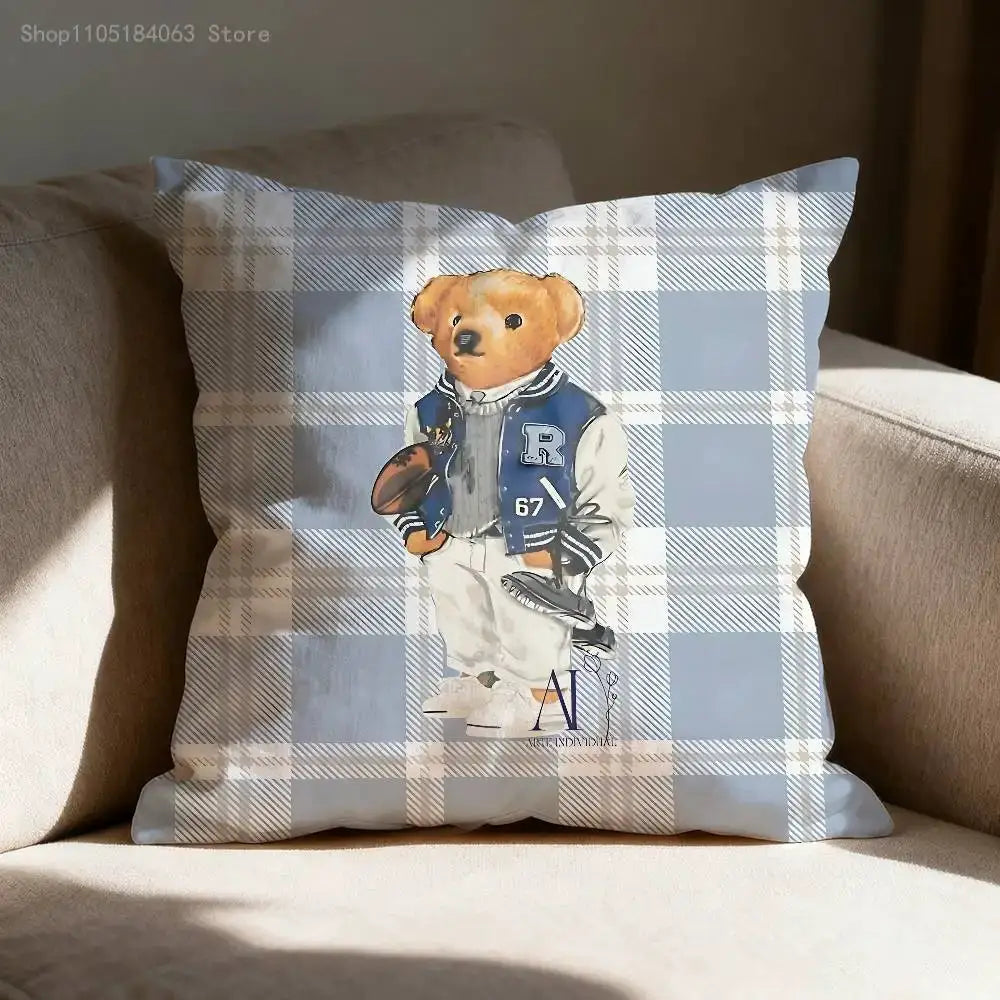 Throw pillow cover by Simples Market featuring a teddy bear in a blue varsity jacket on a blue plaid background