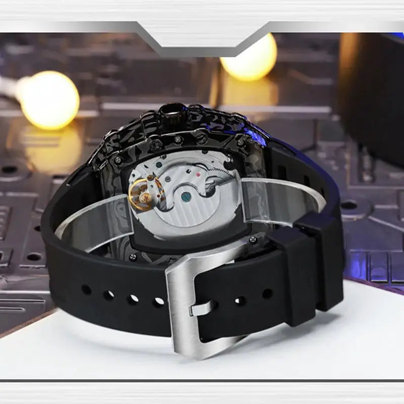 MUSANFIGO automatic hollow mechanical watch with black silicone strap, barrel-shaped case, skeleton back