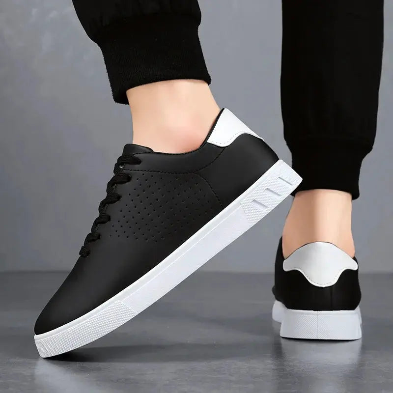 Men's black leather lace-up sneakers with perforated side panels and white sole