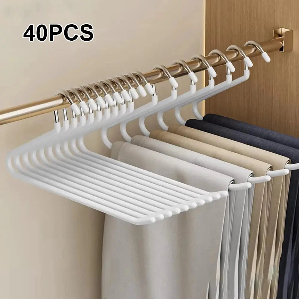 Goose-shaped white pants rack with 40 hangers on a closet rod