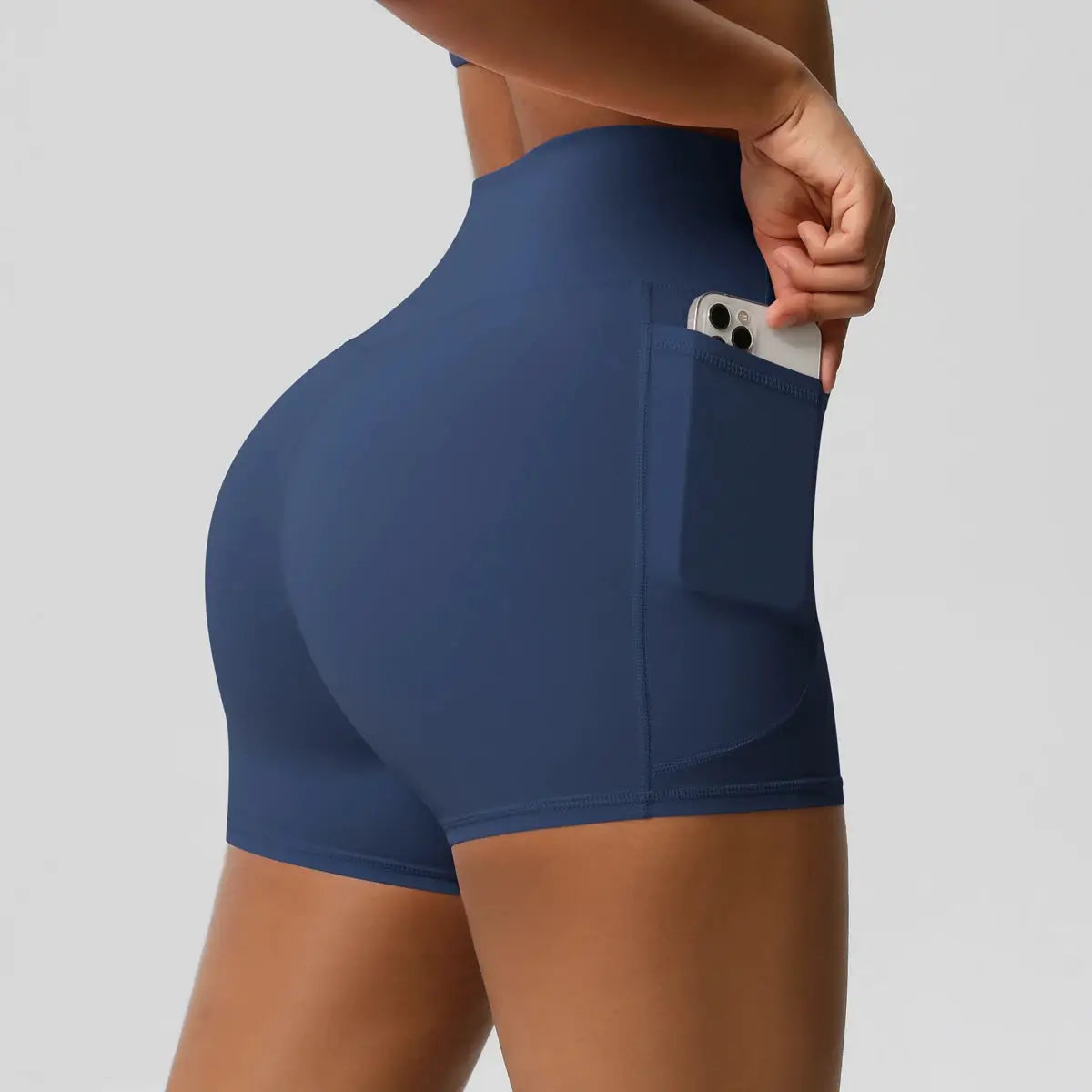 Women’s navy high-waisted yoga shorts with pocket for workouts