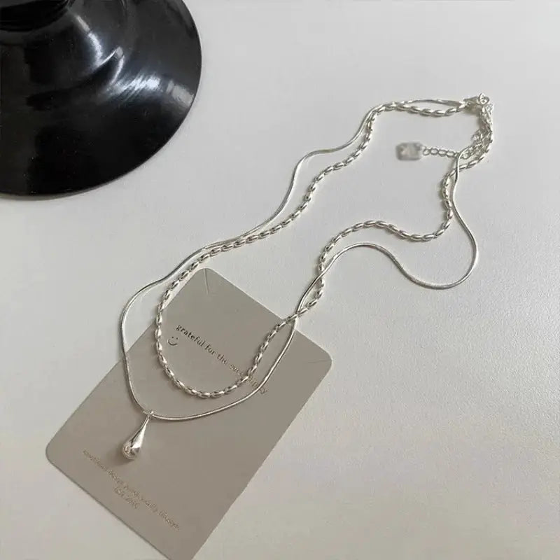 Sterling silver necklace with drop pendant and double-collar chain