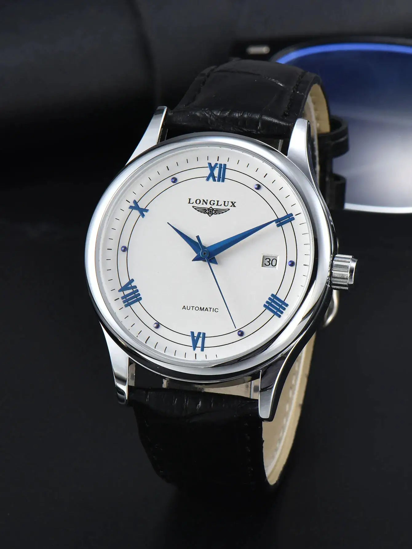 LONGLUX automatic men's wristwatch with white dial, blue hands and Roman numerals, black leather strap, date window