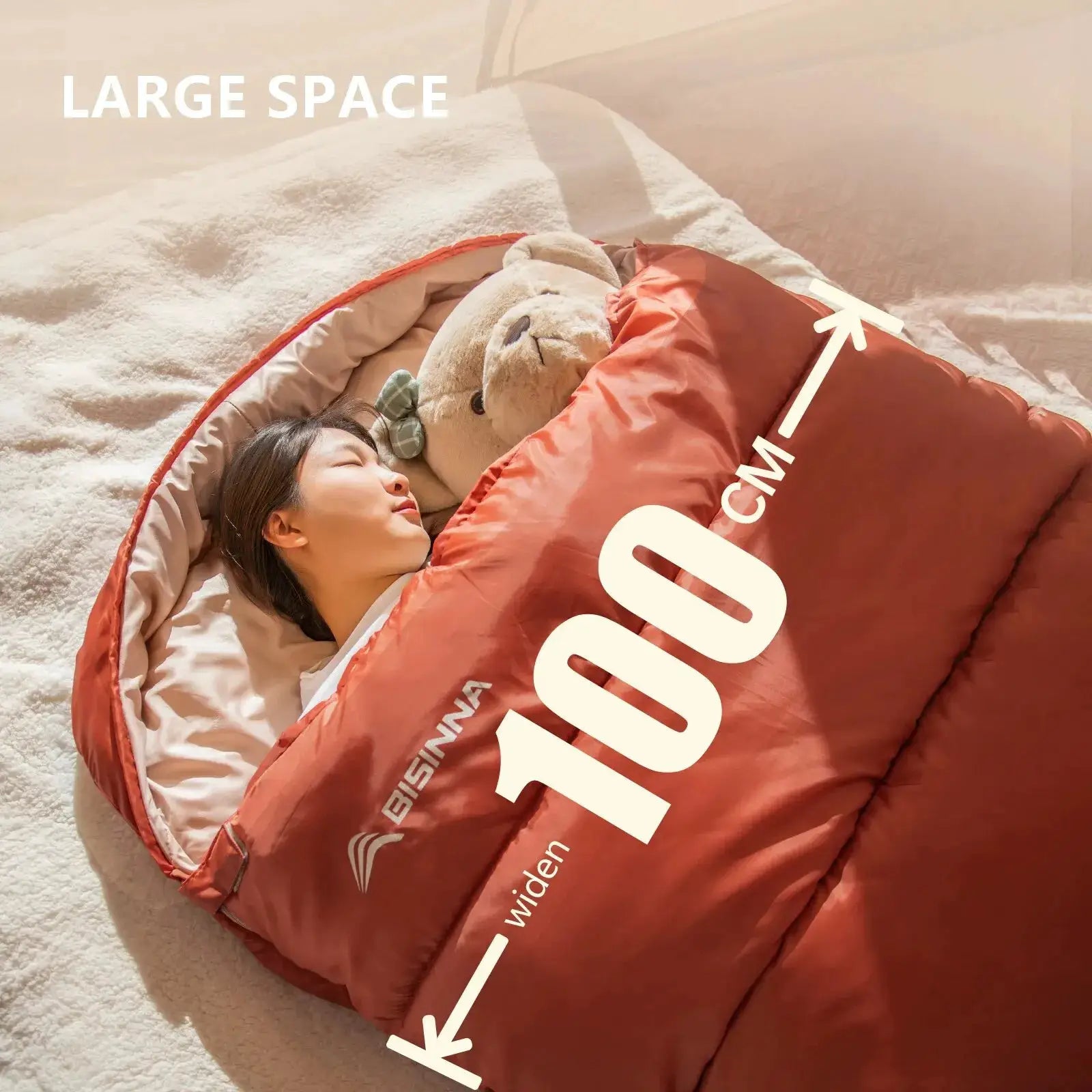 BISINNA large camping sleeping bag, orange, wide long size for adults, in use