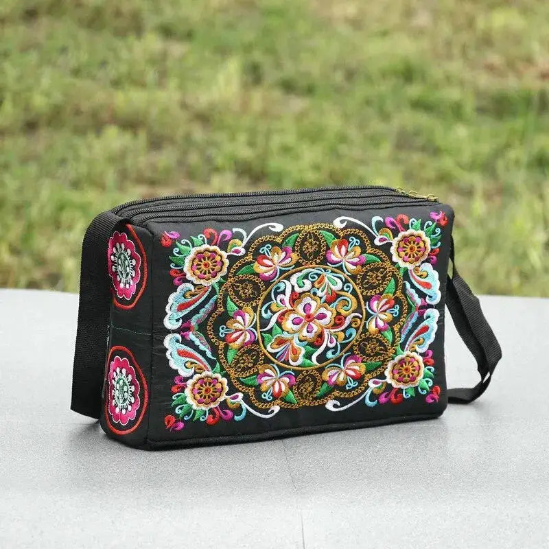 Women's black nylon crossbody bag with vivid multicolor floral embroidery; large-capacity travel bag
