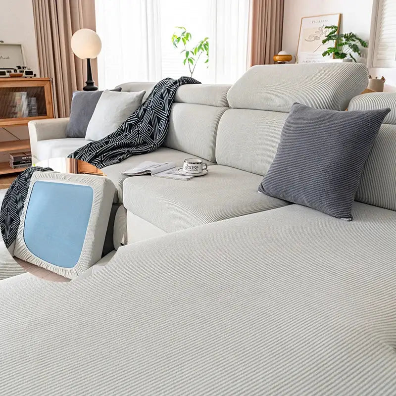 Elastic sofa cover by Simples Market in light gray fabric for living room sofas