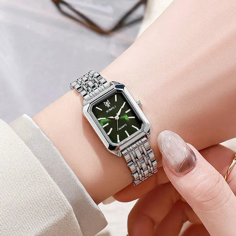 Simples Market luxury women's rectangular quartz watch with stainless steel band and dark green dial.