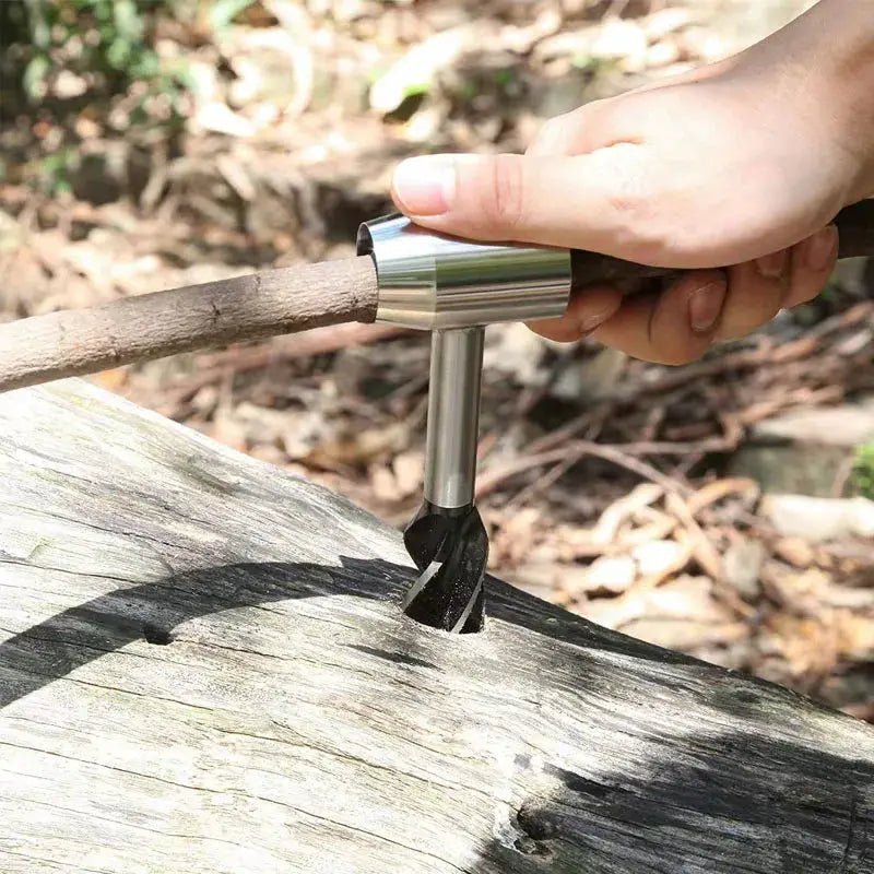 Auger wrench hand drill, silver metal outdoor survival tool for drilling into wood during bushcraft.
