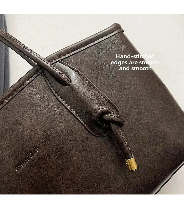 PU leather shoulder bag for women by Simples Market in brown with gold-tipped drawstring