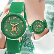 Casual round women's quartz watch with green silicone strap and green dial with gold-tone numerals.