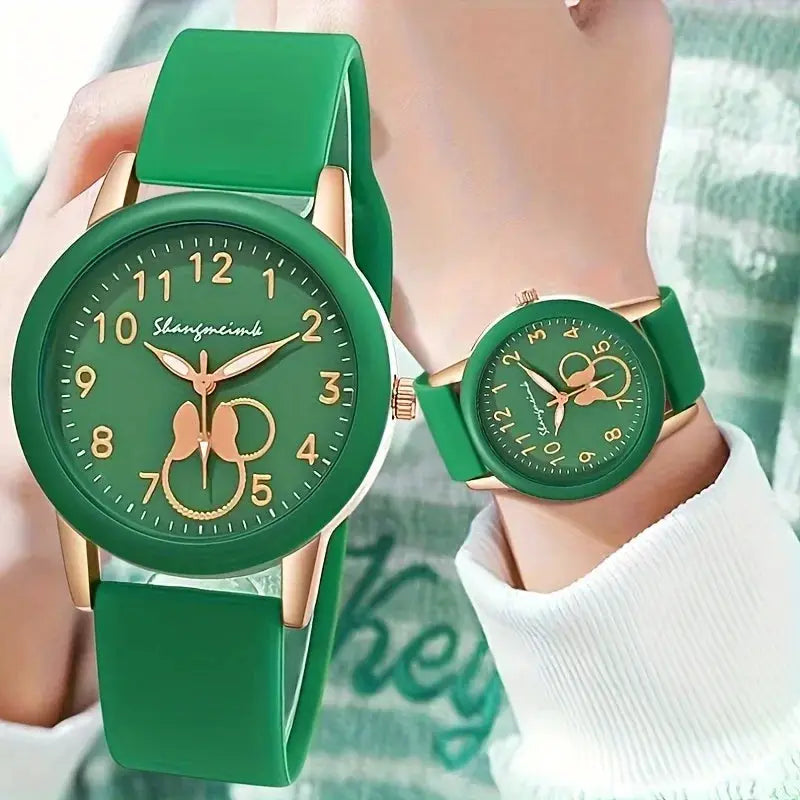 Casual round women's quartz watch with green silicone strap and green dial with gold-tone numerals.