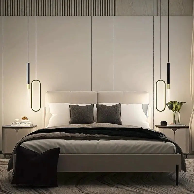 Simples Market Nordic LED pendant lights, two oval black hanging lamps with warm glow above a modern bedroom bed.