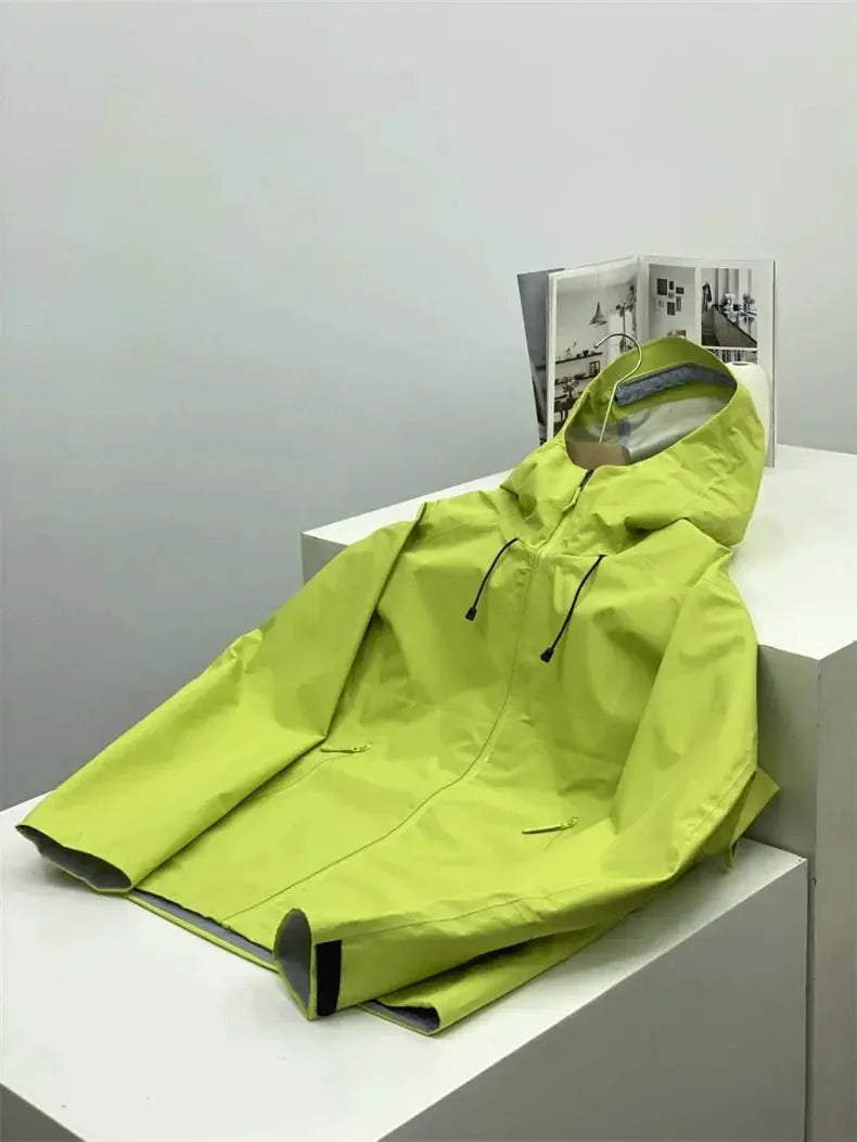 Soft-shell outdoors jacket with neon lime color, hooded, windproof, front zip, and pockets