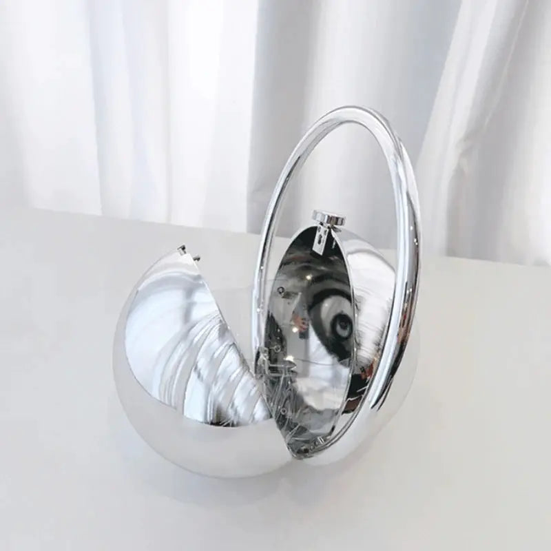 Silver acrylic evening clutch with a spherical ball handle, mirror-finish luxury handbag for weddings