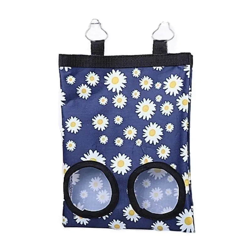 Rabbit hay bag by Simples Market, hanging feeder in blue daisy pattern with two circular feeding holes