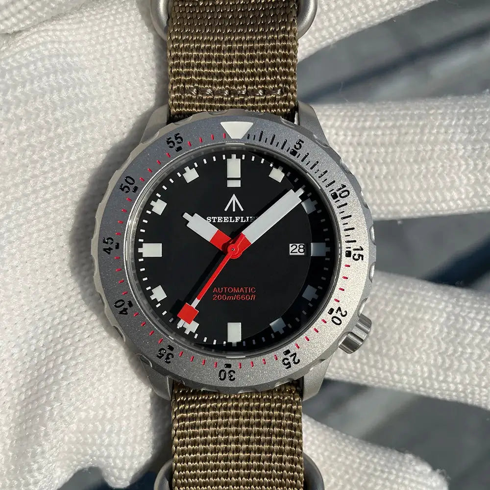 STEELFLIER SF752 automatic diver watch with black dial, silver bezel, and khaki fabric strap, 200m water resistance