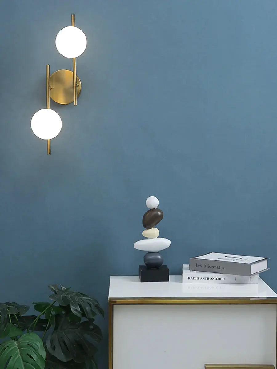 Modern LED wall lamp with golden finish and milky glass globes, double-globe bedside wall light
