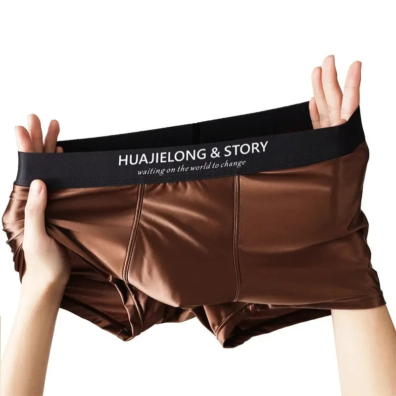 Men's brown satin boxers with black elastic waistband branded HUAJIELONG & STORY.