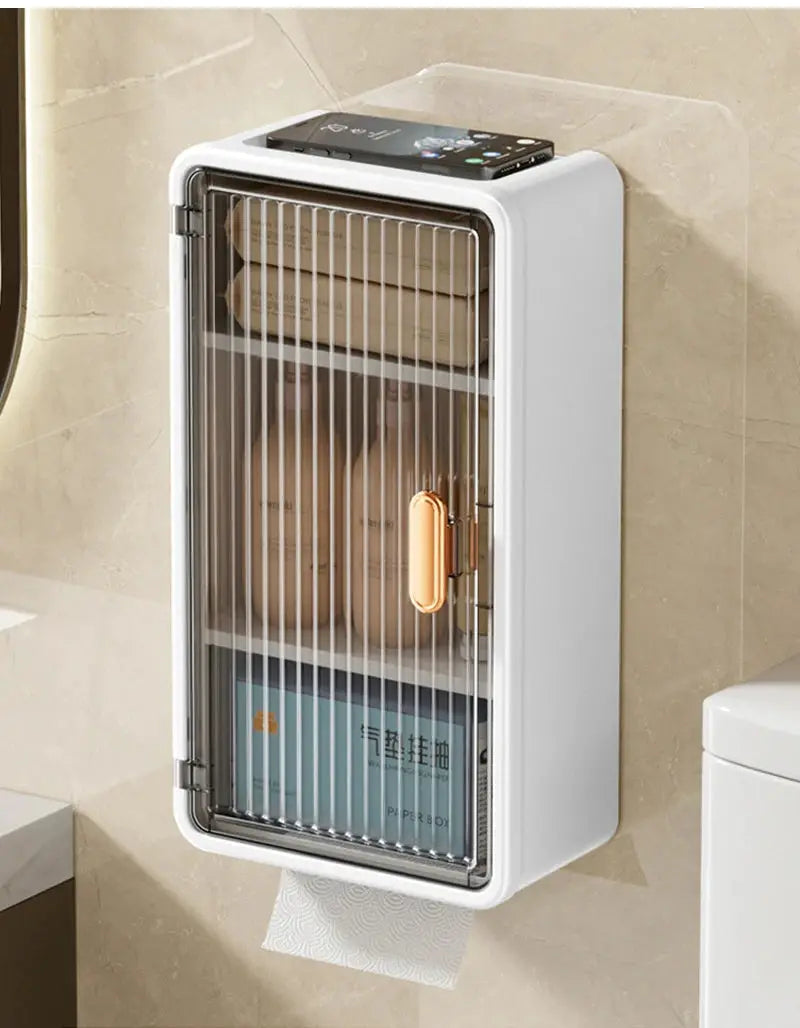 White wall-mounted bathroom storage rack with a clear ribbed door and copper handle for toiletries and tissues.