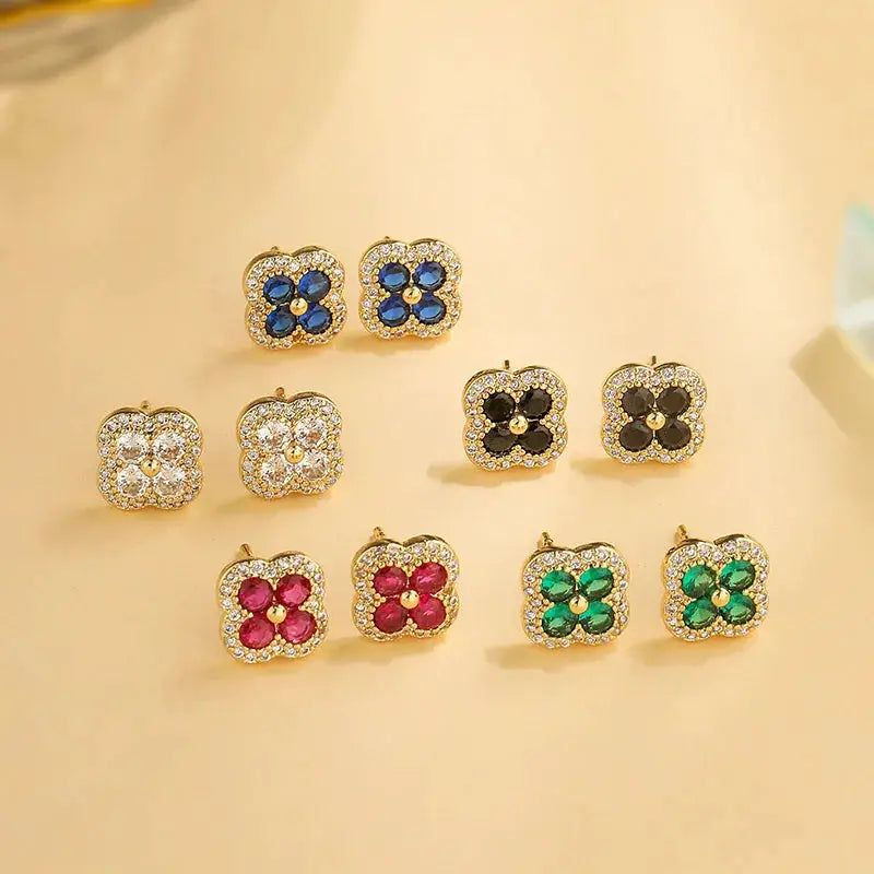 Flower-shaped CZ stud earrings, 18K gold-plated, set of 9 pairs in blue, white, black, pink, red and green