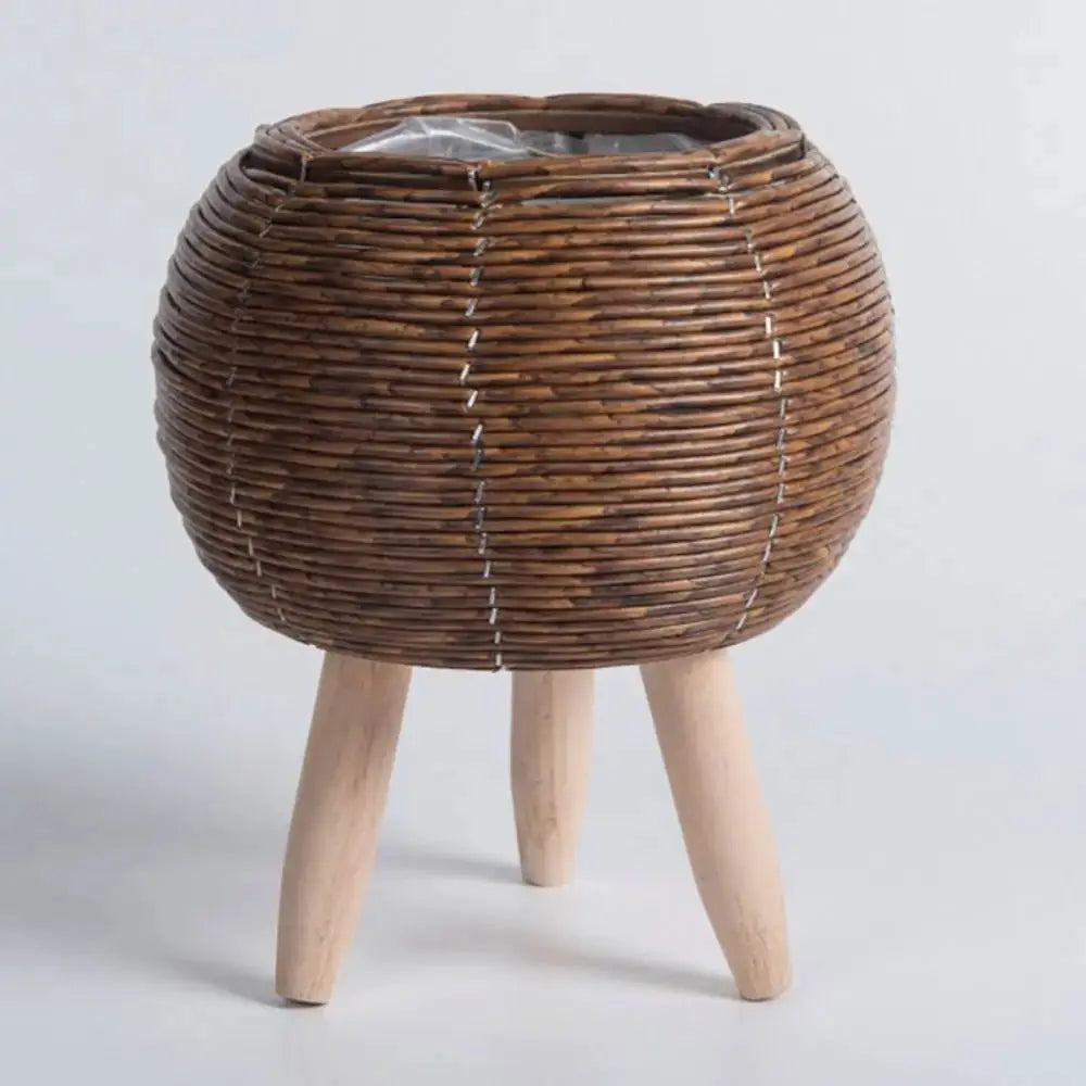 Brown rattan woven flower pot planter on three removable wooden legs
