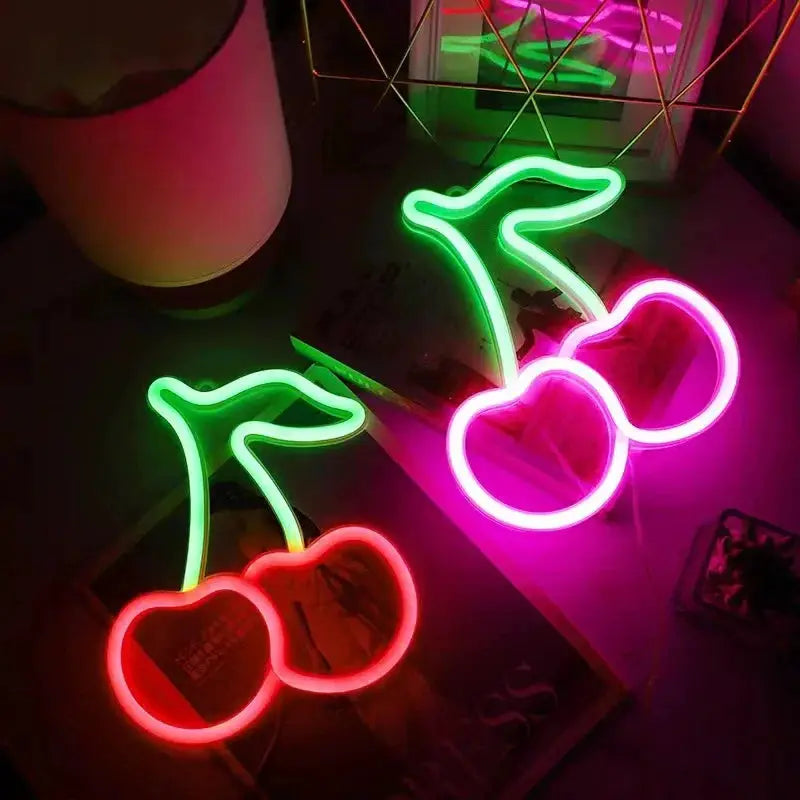 Two cherry neon LED signs with green stems, red and pink fruit outlines, USB or battery powered decorative lights