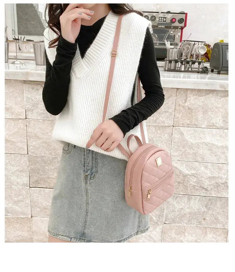Pink quilted mini backpack with gold zippers and crossbody strap by Simples Market