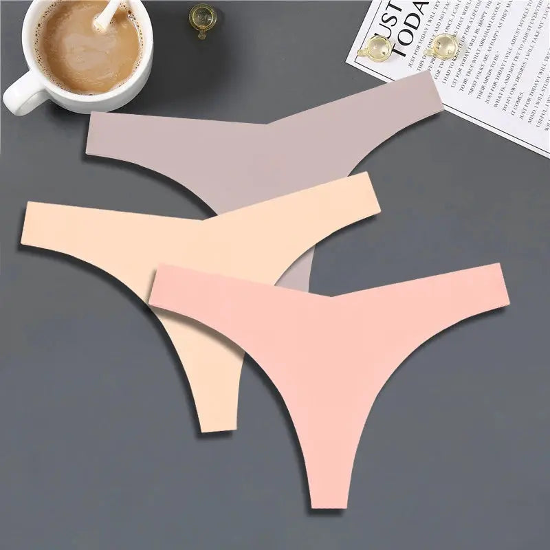 3-pack women's ice-silk seamless G-string thong underwear in pastel lavender, nude, and pink.