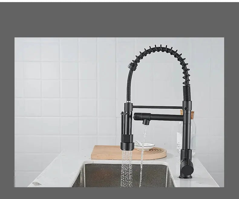 Black pull-down kitchen faucet with high-arc spring neck and single-handle design over sink