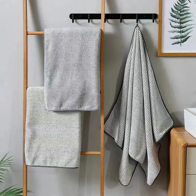 Quick-Drying Bamboo Striped Towel Set, 3-piece with gray bath towel and navy-striped towels on a wooden ladder rack