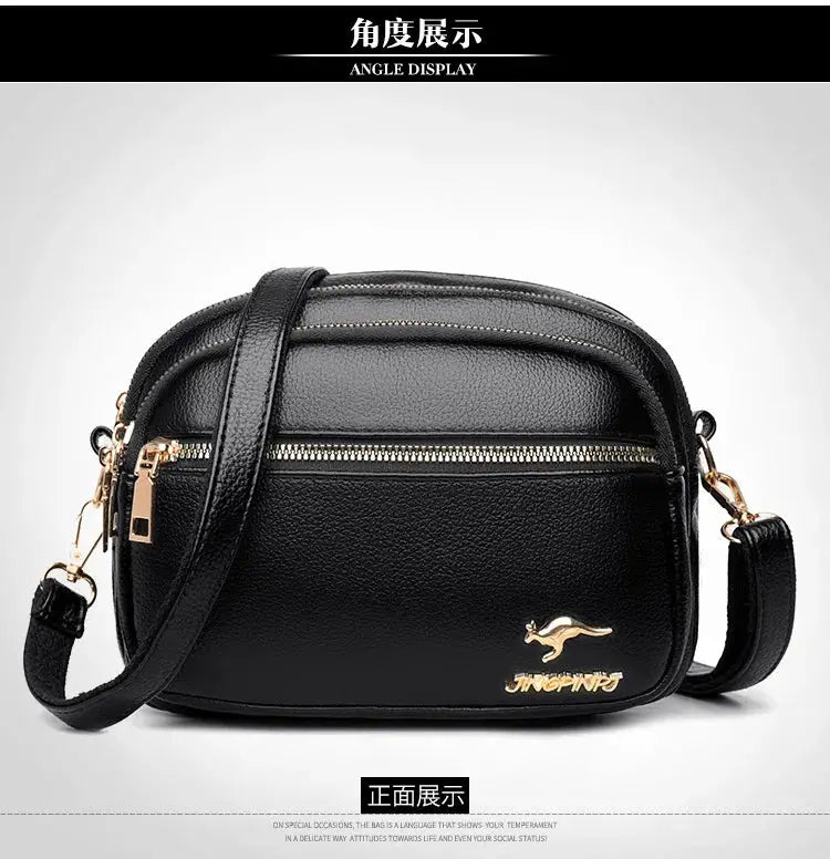 Leather crossbody purse by Simples Market, black pebbled leather with gold zippers and multi-pocket design