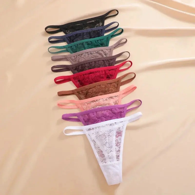 7-piece lace thong set in assorted colors, low-rise floral lace G-strings.