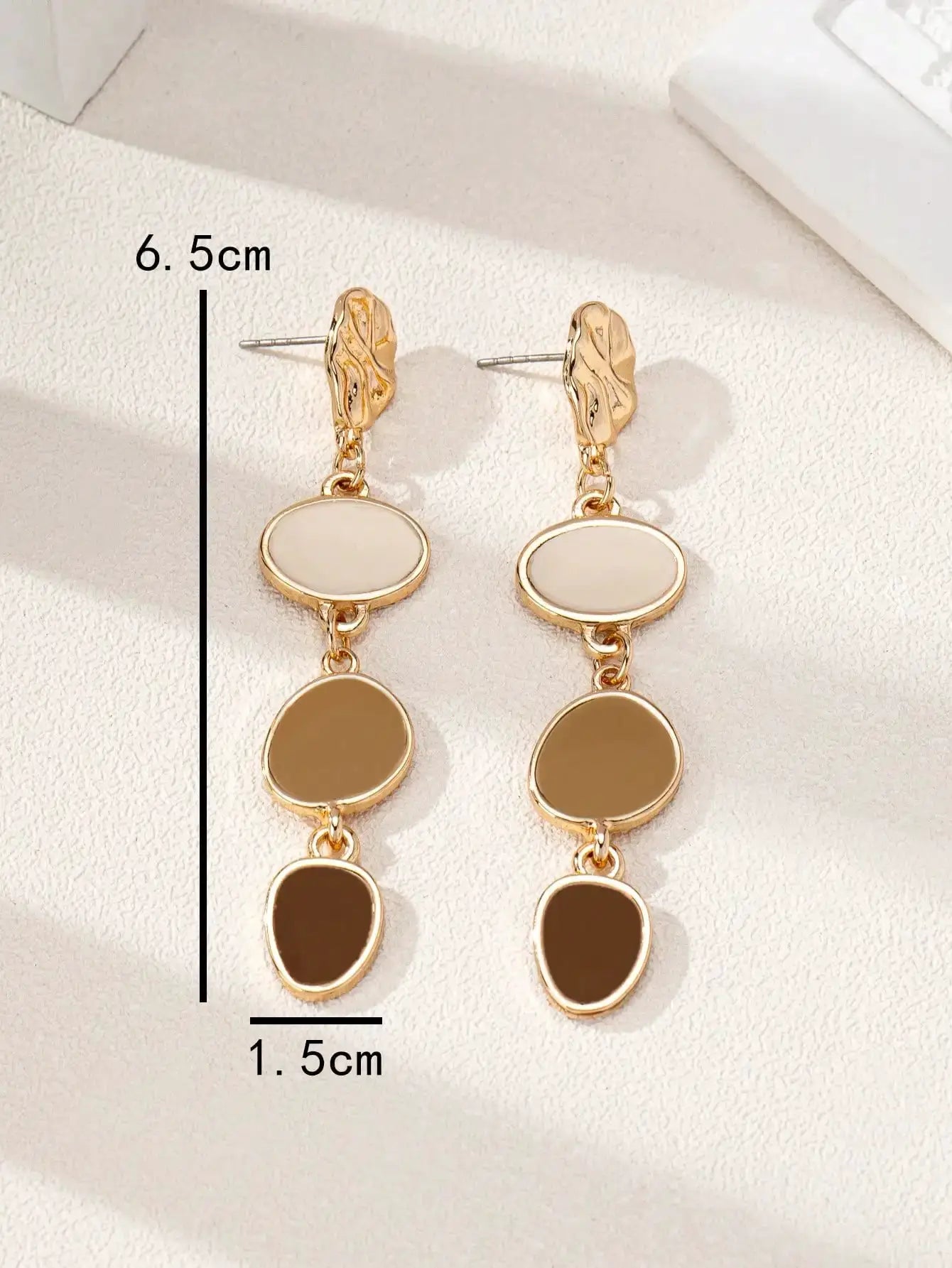 Simples Market pair of gold-tone drop earrings with white and brown oval cabochons, tiered links, about 6.5 cm long