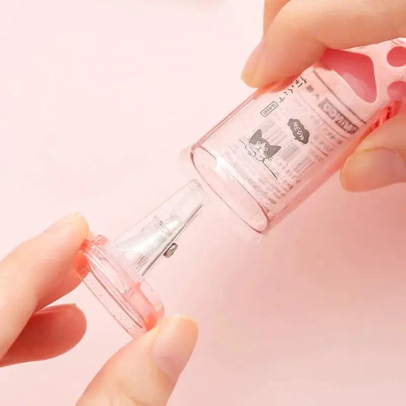 Simples Market kawaii cat paw pencil sharpener, pink transparent plastic with visible blade