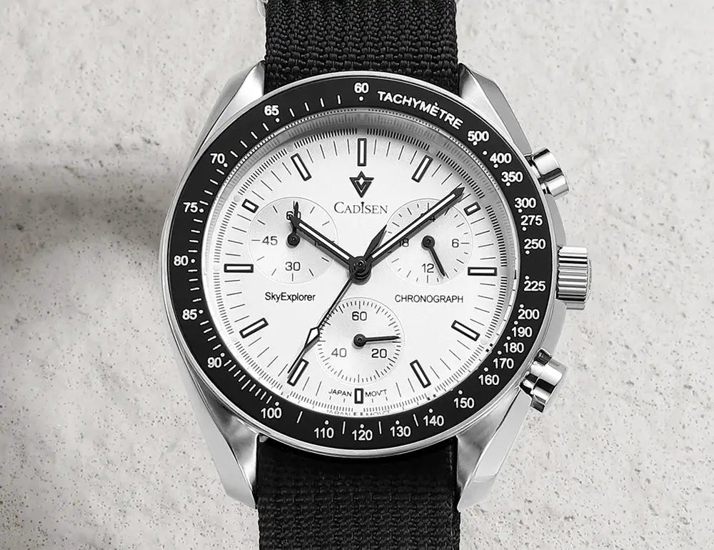 CADISEN men's chronograph watch with white dial, black tachymeter bezel, stainless steel case and canvas strap