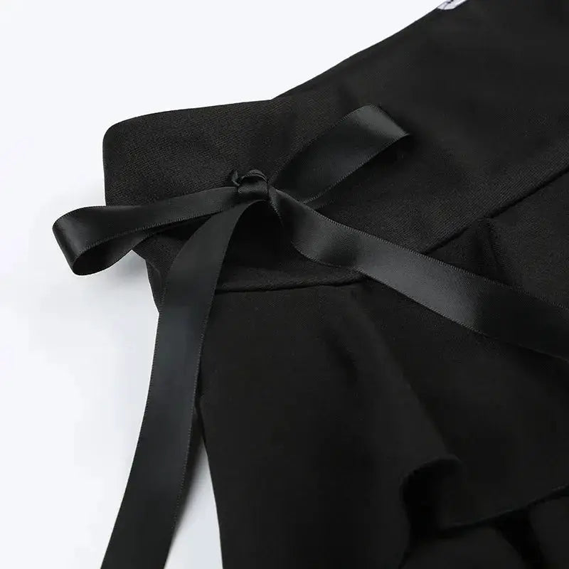Goth Y2K black A-line mini skirt with satin waist bow accent