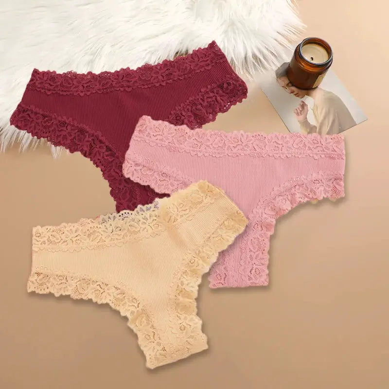 3-piece set of women's cotton panties with floral lace trim in burgundy, pink, and peach.