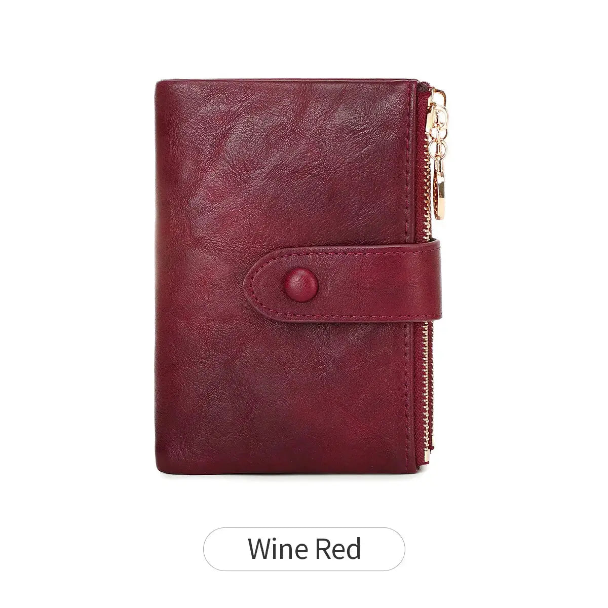 Minimalist women's wallet by Simples Market in wine red with strap closure and gold zipper.